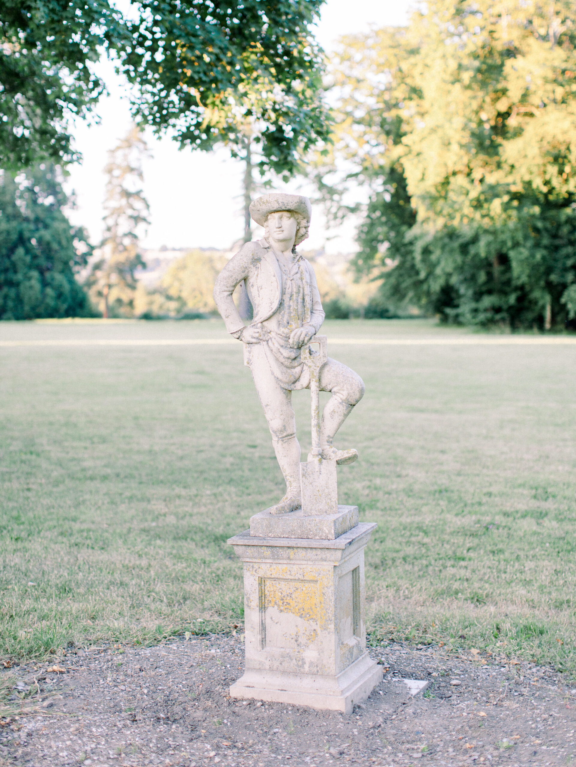 18th century statue of an aristocrat in the garden of a french chateau wedding venue