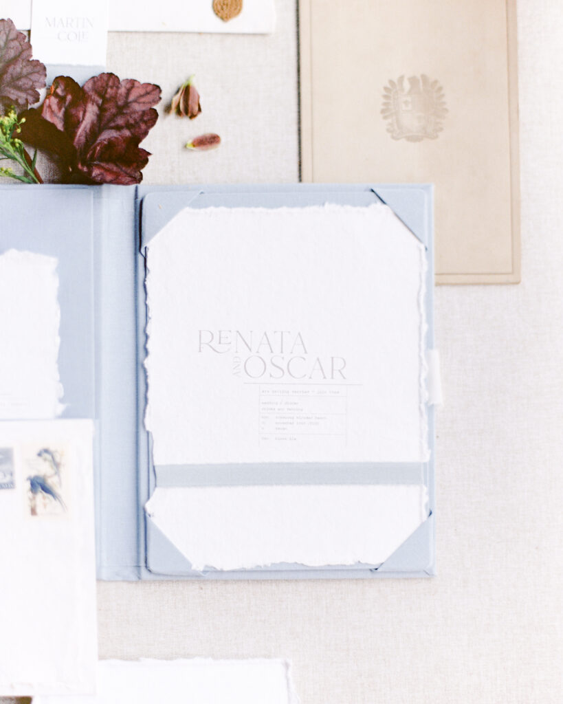 deckled edge wedding invitation in a french blue folio, wedding day details by Boston wedding photographer Ashley Helen